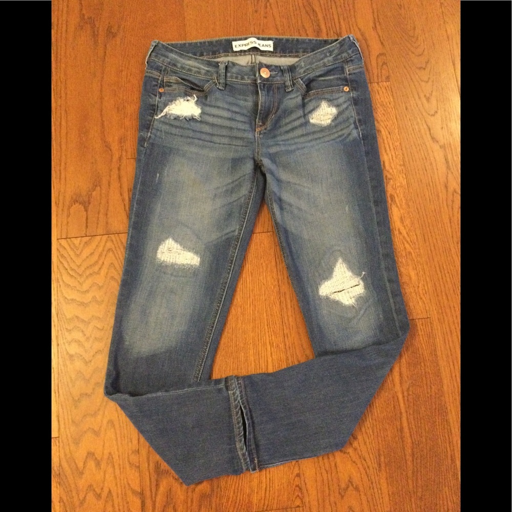 Express Boyfriend low rise skinny jeans in medium blue.